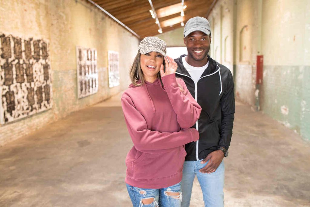 smiling man and girl wears dad hats