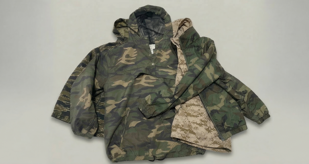 Camouflage outdoor jackets featuring woodland camo and digital camo patterns designed for hiking, camping, and adventure brands.